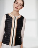 Black quilted vest with contrasting beige