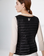 Black quilted vest with contrasting beige