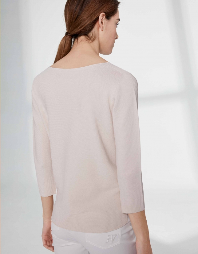 Sandy-colored sweater with round neckline