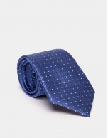 Blue silk jacquard tie with dots. 