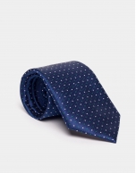 Blue silk jacquard tie with dots. 