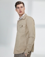 Sandy-colored windbreaker with pockets