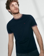 Navy blue top with red ribbed collar