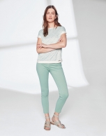 Pastel green pants with fringe hem