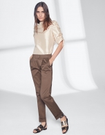 Khaki green pants with turned-up hem