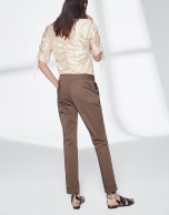 Khaki green pants with turned-up hem