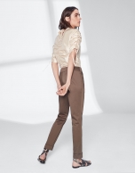 Khaki green pants with turned-up hem