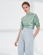 Pastel green silk blouse with puckered sleeves