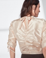 Beige silk blouse with puckered sleeves