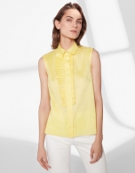 Yellow sleeveless blouse