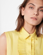 Yellow sleeveless blouse