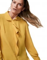 Gold shirt with ruffles