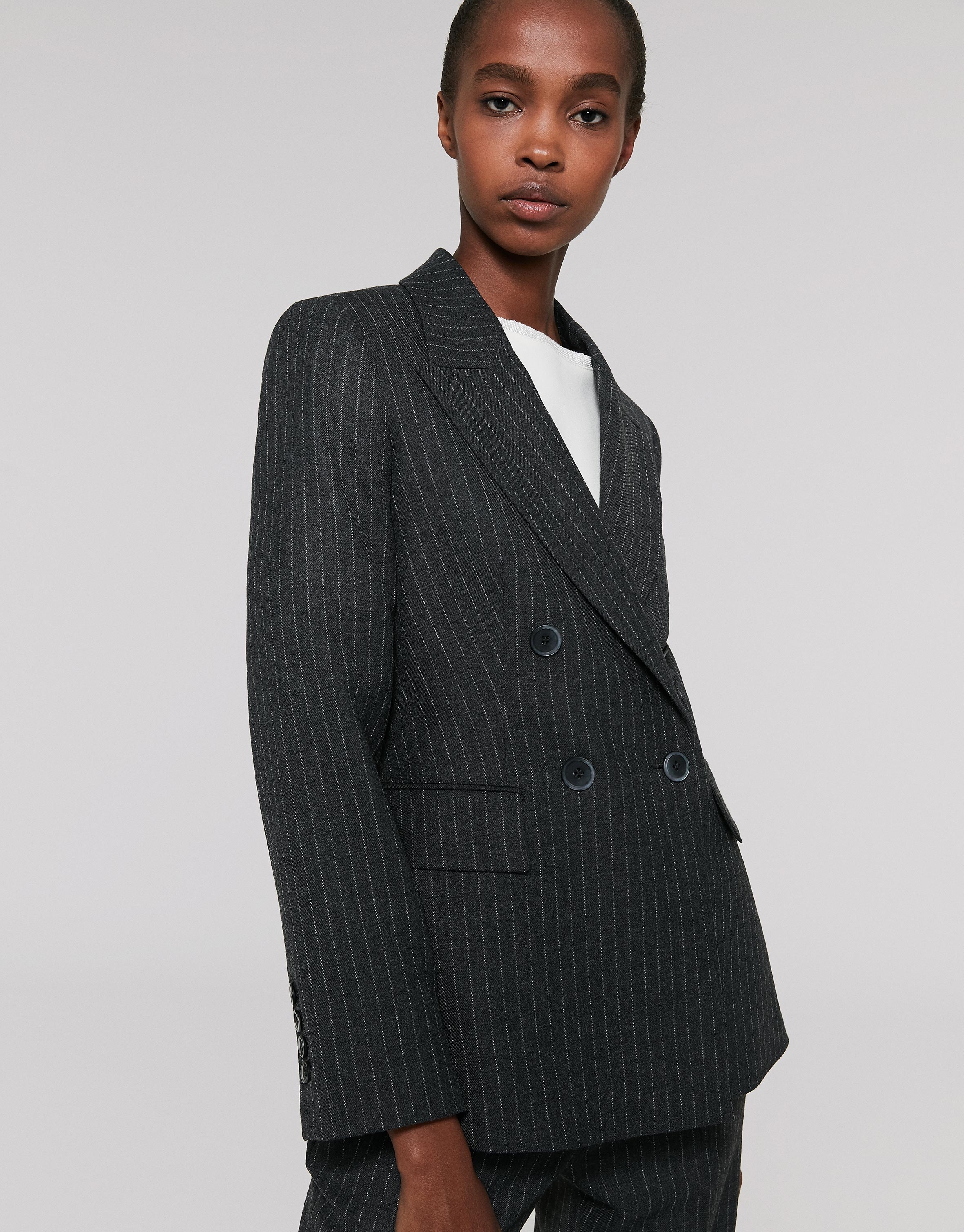 Gray pinstripe sports jacket, with two rows of buttons