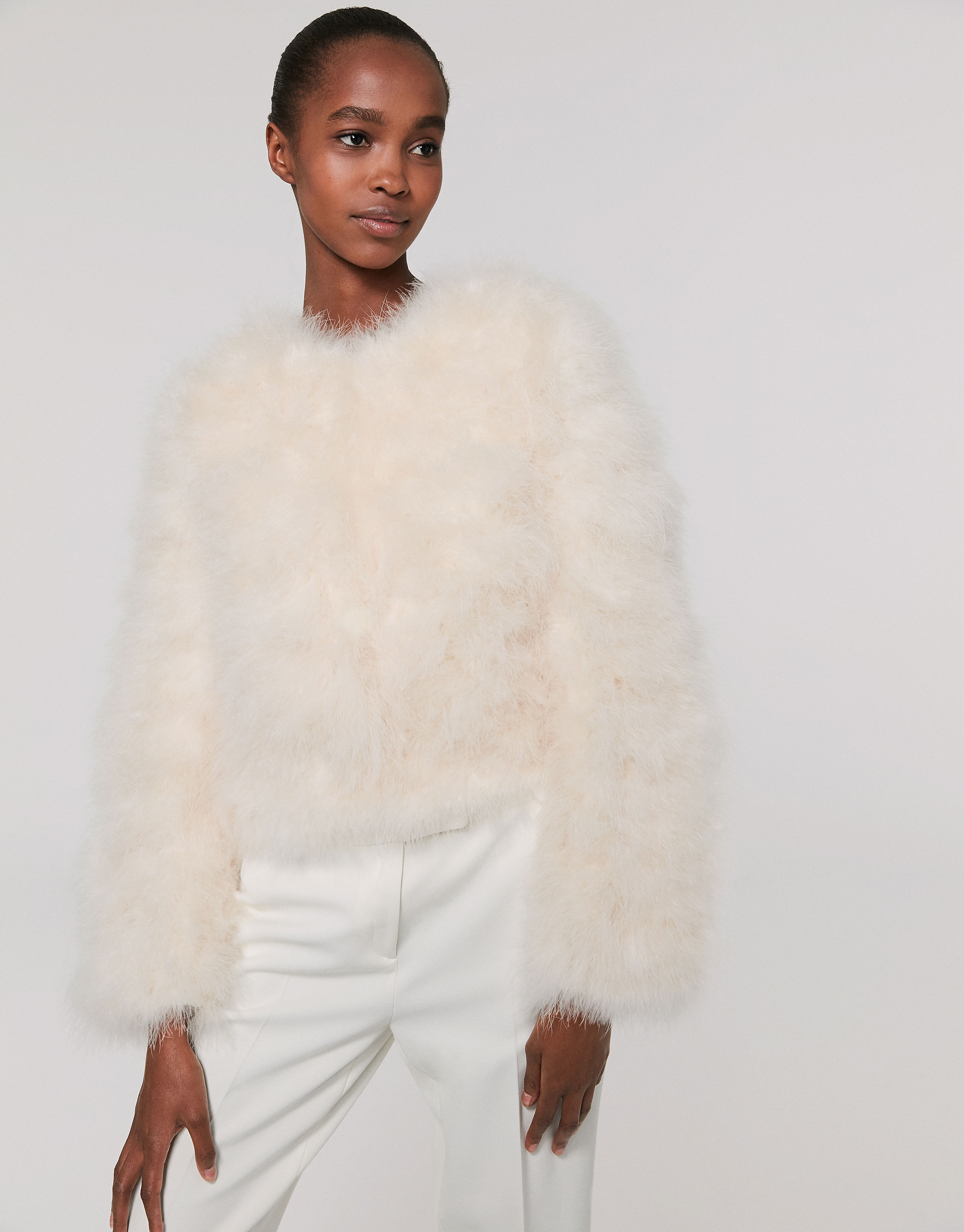 Oversize white jacket with turkey feathers