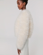 Oversize white jacket with turkey feathers