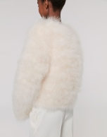 Oversize white jacket with turkey feathers