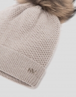 Beige knit cap with pompom