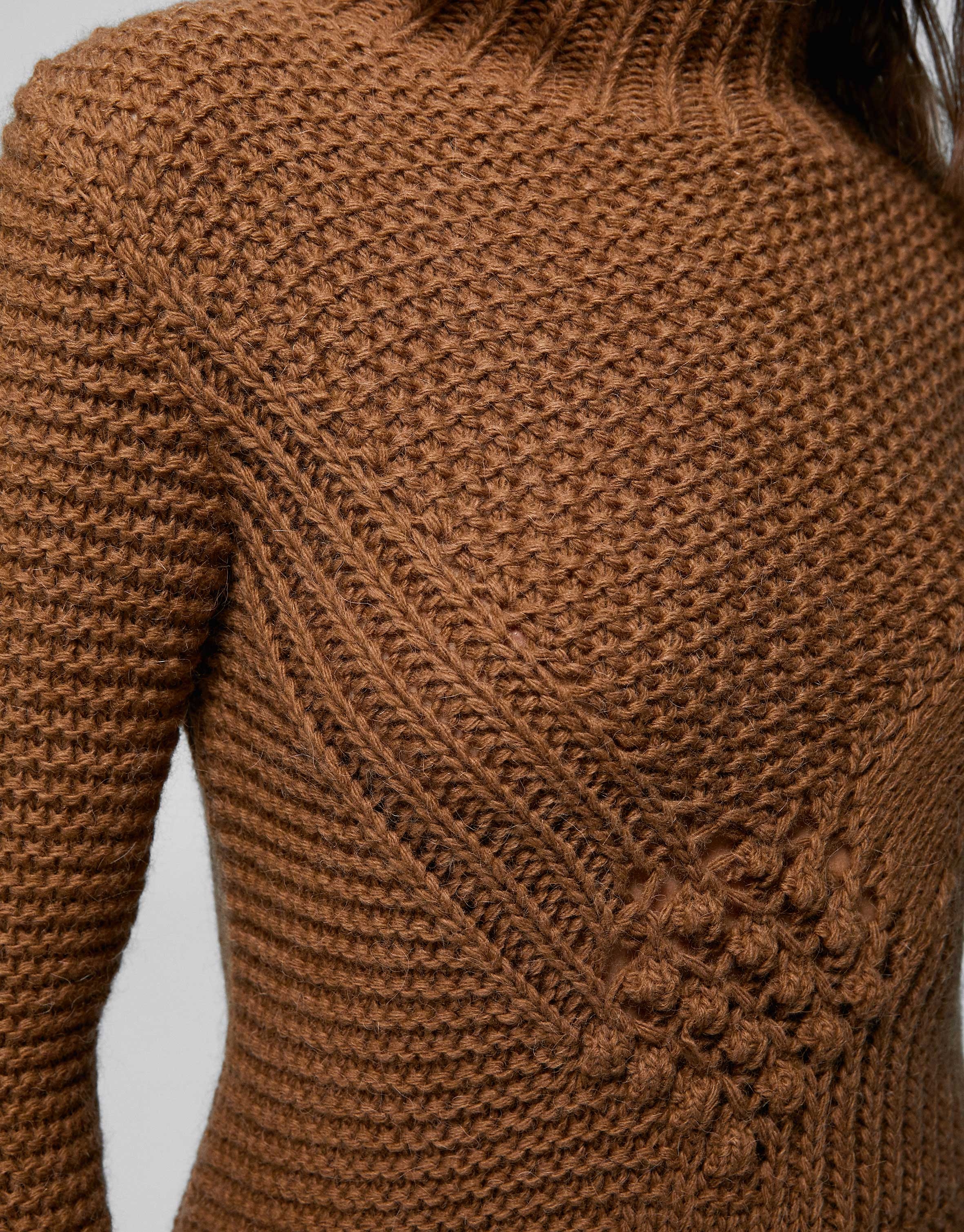 Brown knit sweater with openwork and knotted design