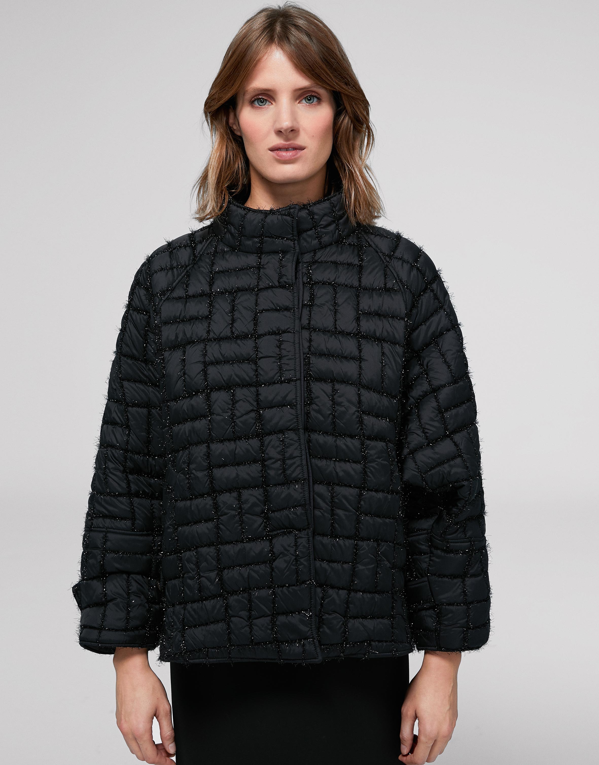 Short black quilted jacket