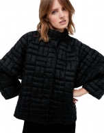 Short black quilted jacket