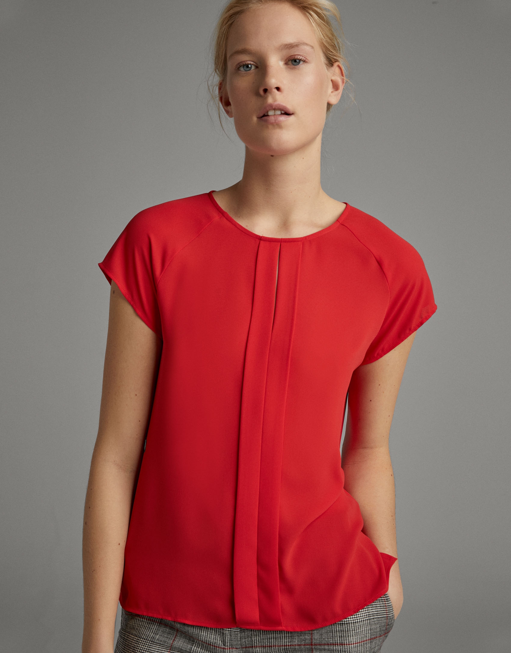 Red blouse with short sleeves