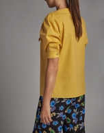 Yellow shirt with boat neck and bow