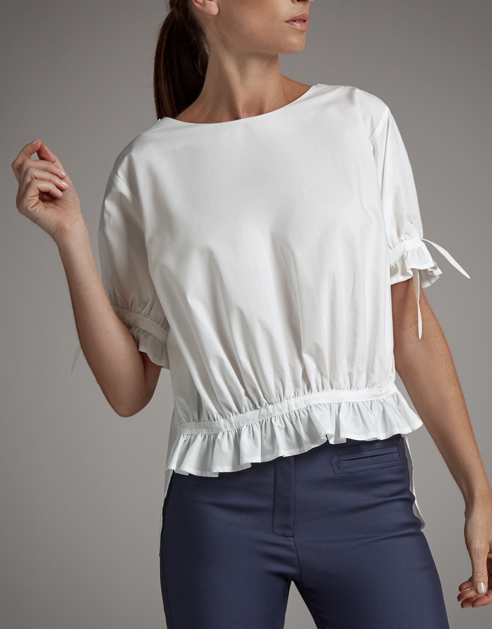 White asymmetric blouse with puffed sleeves