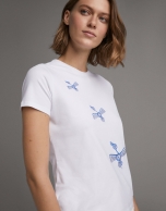 White top with embroidered blue birds