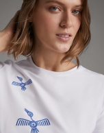 White top with embroidered blue birds