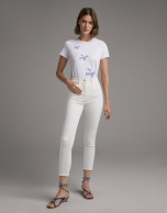 White top with embroidered blue birds