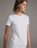 White top with lace on the front and sleeves