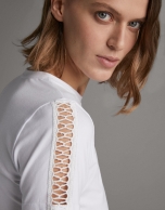 White top with lace on the front and sleeves