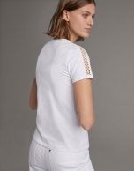 White top with lace on the front and sleeves