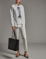 White sweatshirt with embroidered bird print and rhinestones