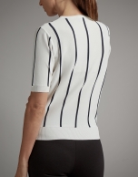 Black and white striped sweater and crossover neckline