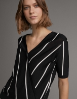 White and black striped sweater and crossover neckline