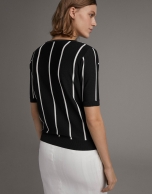 White and black striped sweater and crossover neckline