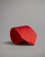 Red tie with navy blue and beige dots