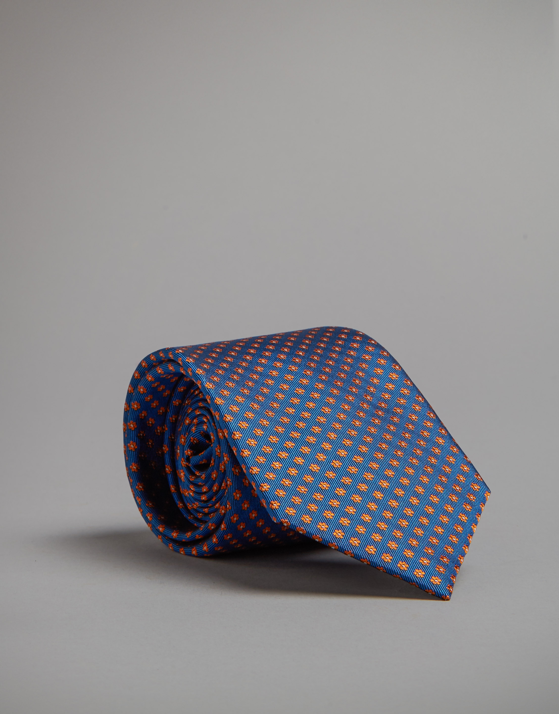 Corbata azul con jacquard flores naranja