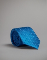 Turquoise tie with white and navy blue polka dots