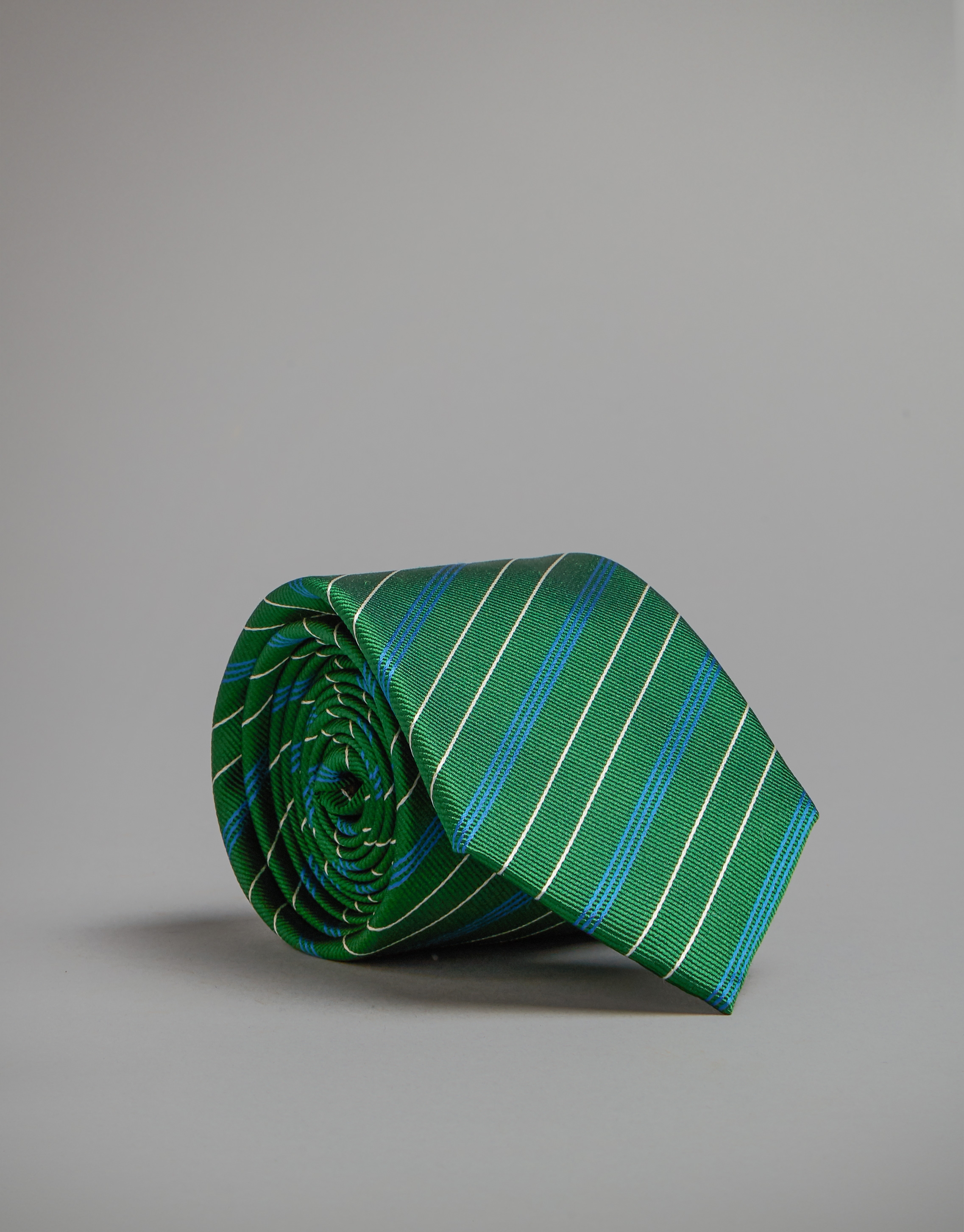 Green tie with blue and white stripes