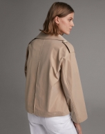 Short beige parka with double row of buttons