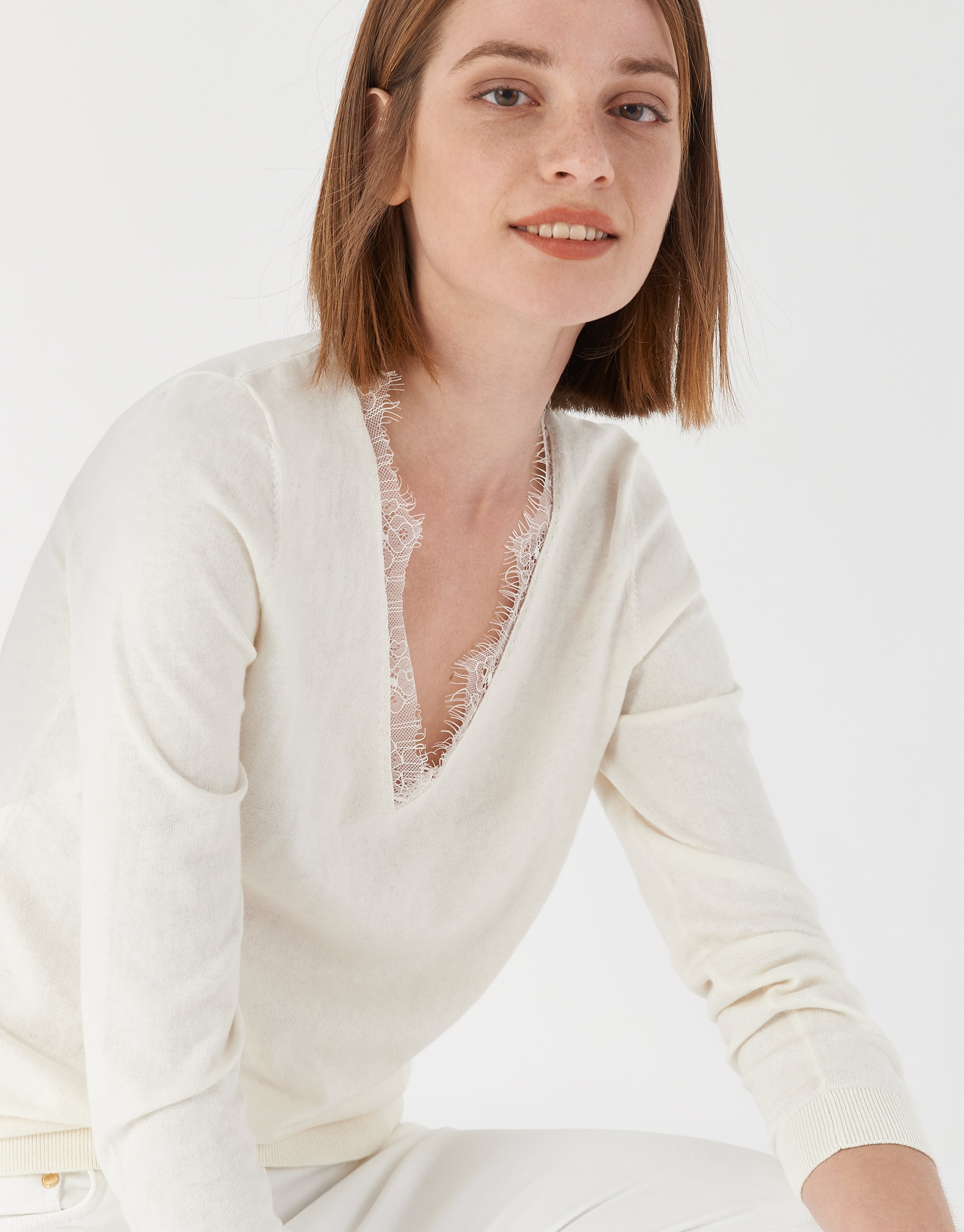 Beige sweater with lace and V-neck