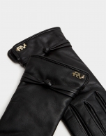 
Black leather glove with decorative knot