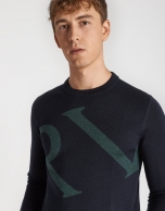 Navy blue sweater with green logo and shawl collar