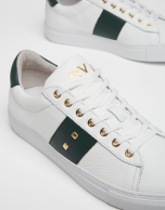 White leather running shoes with studs