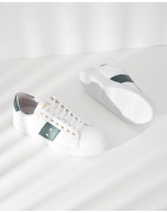 White leather running shoes with studs