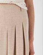 Sand-colored midi skirt with yoke and pleats