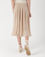 Sand-colored midi skirt with yoke and pleats