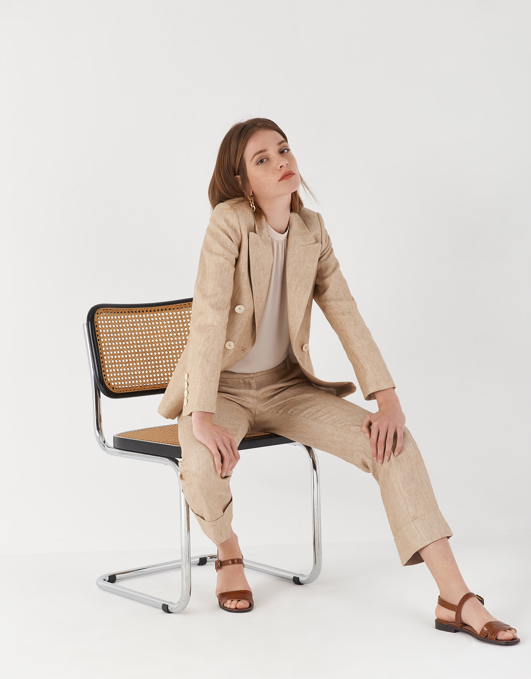 Sand-colored linen pants with turned up cuffs